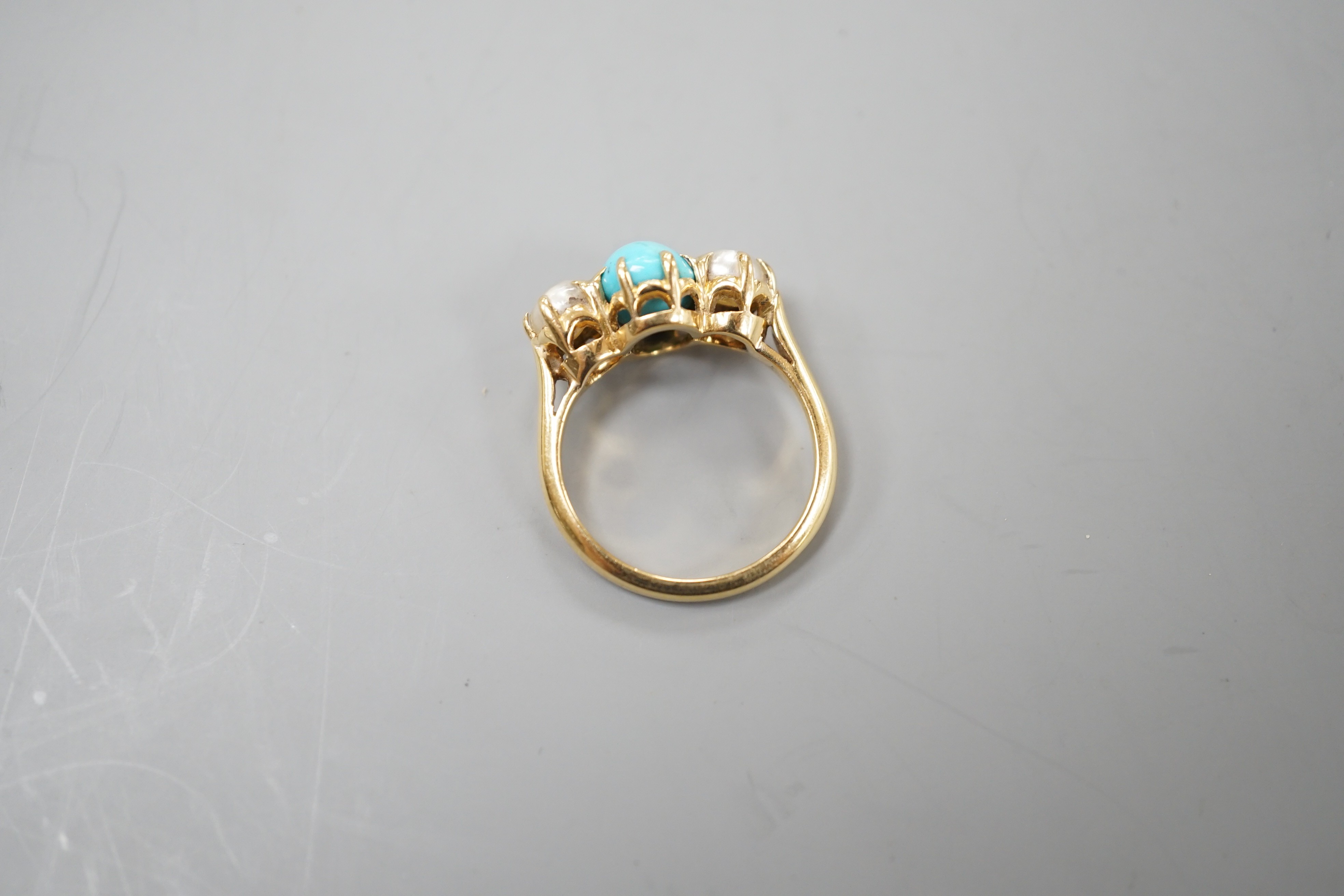 A yellow metal, turquoise and split pearl set three stone ring, size L, gross weight 4.8 grams.